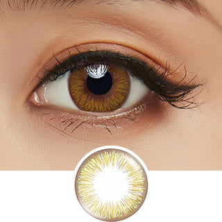 Close-up shot of model's eye adorned with Acuvue 1-Day New Define Fresh Hazel color contact lens dailies, complemented by clean eye makeup, showing the brightening effect of the hazel contact lens on dark brown eyes, above a cutout of the colour contact lens design with radial spiked pattern.