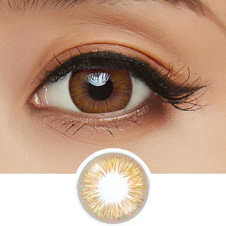 Close-up shot of model's eye adorned with Acuvue 1-Day New Define Fresh Honey color contact lens dailies, complemented by clean eye makeup, showing the brightening effect of the honey contact lens on dark brown eyes.