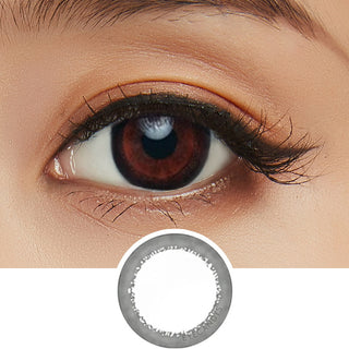 Close-up shot of model's eye adorned with Acuvue 1-Day Define Accent Black color contact lens dailies, complemented by clean eye makeup, showing the widening effect of the circle lenses on dark brown eyes, above a cutout of the colour contact lens design with radial spiked pattern