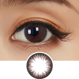 Close-up shot of model's eye adorned with Clalen Iris Rhapsody Brown daily color contact lenses with prescription, paired with clean-girl eye makeup, showing the brightening and enlarging effect of the circle contact lens on dark brown eyes, above a cutout of the contact lens with limbal ring on a white background.
