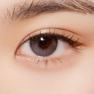 Macro shot of an eye wearing the Olola Daymood 1-Day Grey (10pk) (KR) prescription colour contact lens, showing the multi-colored detail and natural effect on dark brown eyes.