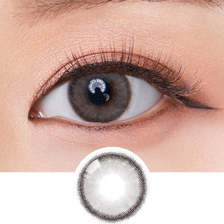 Macro shot of an eye wearing the Olola Dearsome Ash Grey (KR) colour contact lens, showing the multi-colored detail and natural effect on dark brown eyes, with clean eye makeup