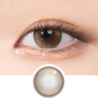 Close-up shot of model's eye adorned with Gemhour Demeter 1-Day Ash Brown (10pk) daily color contact lenses with prescription, complemented by clean eye makeup, showing the brightening and enlarging effect of the circle contact lens on dark brown eyes, above a cutout of the contact lens pattern with limbal ring on a white background.