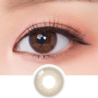 Macro shot of an eye wearing the Olola Dewie Brown (KR) colour contact lens, showing the multi-colored detail and natural effect on dark brown eyes, with clean eye makeup