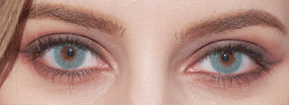 EyeCandys Dewy Aqua blue opaque color eye contacts on a brown-eyed model with smokey eye makeup, blinking her eyes open