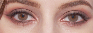 EyeCandys Dewy Honey brown opaque color eye contacts on a brown-eyed model with smokey eye makeup, blinking her eyes open