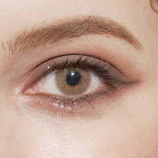 Close-up of Pink Label Dewy Honey brown colored contact lens