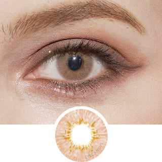 Close-up of Pink Label Dewy Honey brown colored contact lens on dark brown eyes