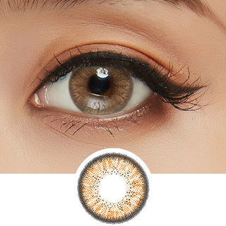 Close-up shot of model's eye adorned with Eyelighter Brown colored contacts for astigmatism, complemented by clean eye makeup, showing the brightening effect of the warm brown contact lens on dark brown eyes.