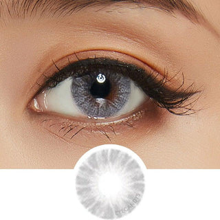 Composite of an Asian eye wearing a grey color contact lens on top of a dark brown eye, on top of the design file of the contact lens itself.