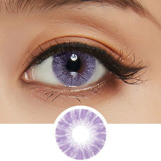 Macro shot of Shade Violet contact lens with intricate spiral dot design, worn on a dark brown Asian eye