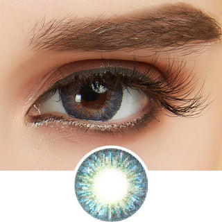 Tri-Color blue color contact lens on top of a dark eye paired with light brown eyeshadow and curled wispy eyelashes, above the prescription contact lens pattern.