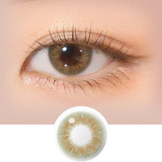 Close-up shot of model's eye adorned with Gemhour Hestia Olive daily color contact lenses with prescription, complemented by clean eye makeup, showing the brightening and enlarging effect of the circle contact lens on dark brown eyes, above a cutout of the contact lens pattern with limbal ring on a white background.