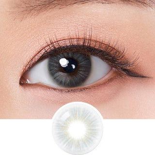 Macro shot of an eye wearing the Olola Heiress Grey (KR) colour contact lens, showing the multi-colored detail and natural effect on dark brown eyes, with clean eye makeup