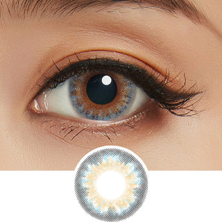 Close-up shot of model's eye adorned with Lilmoon Monthly Water Water Blue-Grey (Prescription) color contact lenses prescription, paired with clean-girl eye makeup, showing the brightening and enlarging effect of the circle contact lens on dark brown eyes, above a cutout of the contact lens with limbal ring on a white background.