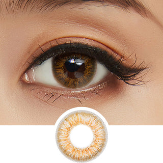 Close-up shot of model's eye adorned with Pink Label Obsession Brown color contact lenses with prescription, complemented by clean eye makeup, showing the brightening and enlarging effect of the circle contact lens on dark brown eyes, above a cutout of the contact lens pattern with limbal ring on a white background.