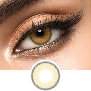 Honey Donut Brown natural colored contacts for astigmatism modelled on a dark brown eye with glamorous eye makeup, above a cutout of the circle lens pattern with limbal ring.