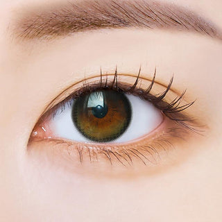 Macro shot of an eye wearing the i-Sha Polaris Ursa Olive Green prescription colour contact lens, showing the multi-colored detail and natural effect on dark brown eyes.