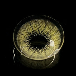 Macro shot of the desire sandy beige prescription colored contact lens on a dark background, showing the detailed pattern of the contact lens design