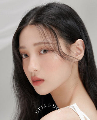 Female model wearing i-DOL Yurial Earl Grey 1-Day (10pk) Colored Contacts Circle Lenses, available in prescription