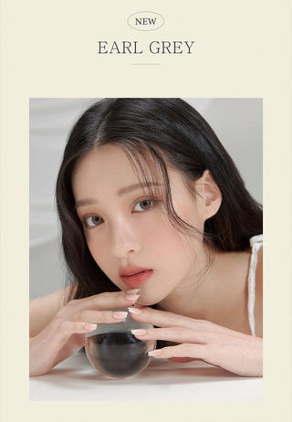 Female model wearing the realistic i-DOL Yurial Earl Grey 1-Day (10pk) Colored Contacts Circle Lenses - EyeCandys