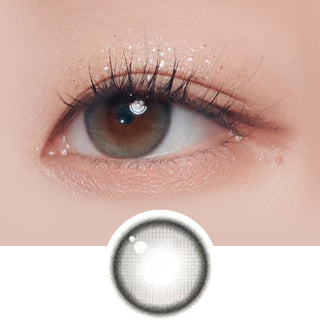 Close-up shot of model's eye adorned with Gemhour Demeter 1-Day Ash Grey (10pk) daily color contact lenses with prescription, complemented by clean eye makeup, showing the brightening and enlarging effect of the circle contact lens on dark brown eyes, above a cutout of the contact lens pattern with limbal ring on a white background.