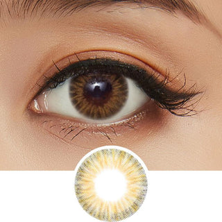 A detailed image showcasing the Pink Label Starburst Brown contact lens on a model's eye, complemented by peach eyeshadow. Additionally, a separate image displays a close-up of the same lens.