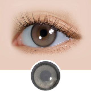 Close-up of i-DOL Yurial Earl Grey circle lens on a model's eye, showing the realistic subtle enlarging effect.