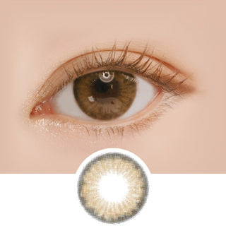 Macro shot of an eye wearing the i-Sha Holy Holic Brown prescription colour contact lens, showing the multi-colored detail and natural effect on dark brown eyes, with clean eye makeup. At the bottom is the pattern of the colored lens design, showing the dotted detail and pigmentation.