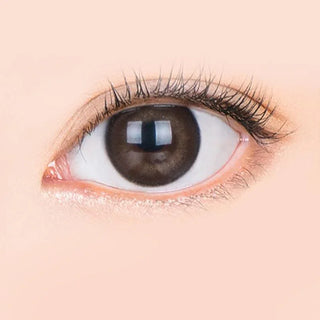 Macro shot of an eye wearing the i-Sha Jadey Gem Choco prescription colour contact lens, showing the multi-colored detail and natural effect on dark brown eyes.