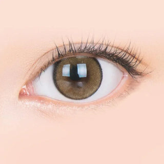 Macro shot of an eye wearing the i-Sha Jadey Stone Brown prescription colour contact lens, showing the multi-colored detail and natural effect on dark brown eyes.