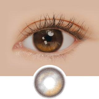 Macro shot of an eye wearing the i-Sha Oriana Edge Plus Shade Brown prescription colour contact lens, showing the multi-colored detail and natural effect on dark brown eyes, with clean eye makeup. At the bottom is the pattern of the colored lens design, showing the dotted detail and pigmentation.