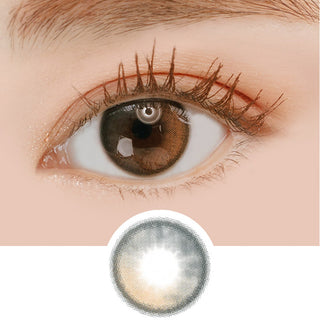 Macro shot of an eye wearing the i-Sha Oriana Shade Grey prescription colour contact lens, showing the multi-colored detail and natural effect on dark brown eyes, with clean eye makeup. At the bottom is the pattern of the colored lens design, showing the dotted detail and pigmentation.