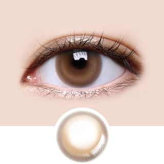 Close-up shot of model's eye adorned with LensMe LilMoon Skin Brown color contact lenses prescription, paired with clean-girl eye makeup, showing the brightening and enlarging effect of the circle contact lens on dark brown eyes, above a cutout of the contact lens with limbal ring on a white background.