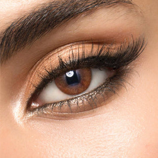 Close-up of Melbourne Brown prescription circle lenses on a model's eye, showing the realistic subtle enlarging effect.