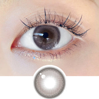 Close-up shot of model's eye adorned with Chuu Milk & Tea Cream Grey daily color contact lenses with prescription, complemented by clean eye makeup, showing the brightening and enlarging effect of the circle contact lens on dark brown eyes, above a cutout of the contact lens pattern with limbal ring on a white background.