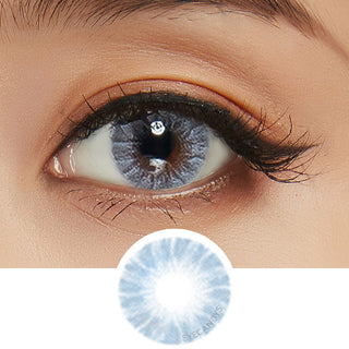 Close-up shot of a model wearing Shade Blue prescription colored contact lens in one eye that is naturally dark-brown, with a cutout of the blue contact lens pattern