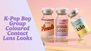 K-pop boy group contact lens flat lay with burgundy, silver, blue, and amber lenses on slate