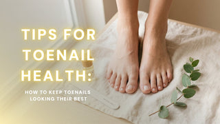 Overhead view of clean bare feet with healthy trimmed toenails on a cream towel surrounded by cuticle oil and a nail file
