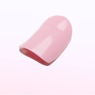 Close-up of EyeCandys pink nail sticker on a nail, perfect for quick and professional-quality nail decoration