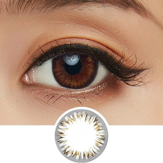 Close-up shot of model's eye adorned with Acuvue 1-Day Define Natural Shine Brown color contact lens dailies, complemented by clean eye makeup, showing the brightening effect of the circle lenses on dark brown eyes, above a cutout of the colour contact lens design with radial spiked pattern