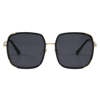 Amalfi  Black Gold sunglasses from EyeCandys, showcasing a chic summer look with purple tinted lenses and a sleek frame