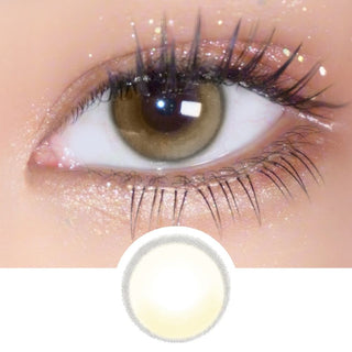 Macro shot of EyeCandys Amelie Biscuit Brown lens on eye with long lashes, with detailed lens pattern displayed underneath.