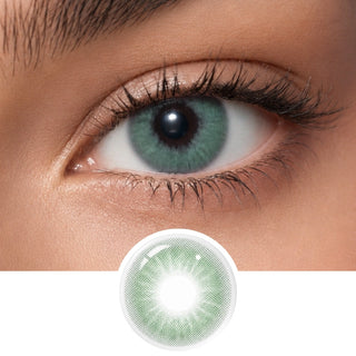 Close-up of an eye wearing EyeCandys Aura Green Grey contact lenses by EyeCandys, with the lens shown separately below. These light green-grey lenses feature a detailed pattern for a jewel-toned effect.