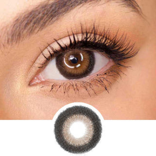 EyeCandys Pink Label Big Ring Brown color contact lens on top of a dark eye paired with subtle eye makeup and curled wispy eyelashes, above the contact lens design.
