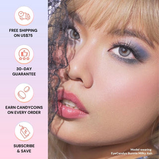 Full face of model wearing EyeCandys Bunnie Milky Ash Grey colored contact lenses. Close-up highlighting silvery ash and creamy beige tones, long lashes, and soft limbal ring for a dreamy, luminous eye look.