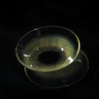 Macro shot of Eyecandys Cashmere Satin Olive prescription colored contact lens, showing detailed lens design and natural olive tones.