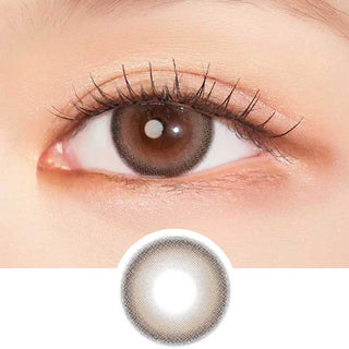 Model with brown eyes wearing EyeCandys Clalen Mimosa Brown Oversea prescription contact lenses, featuring a warm brown color with a defined limbal ring for enhanced eye definition. These lenses offer a natural, captivating look and all-day comfort