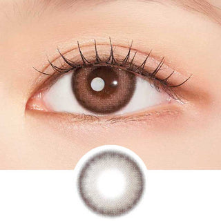 Model with brown eyes wearing EyeCandys Clalen Pink Tulip Brown Oversea prescription contact lenses, featuring a brown base with a hint of pink and a defining limbal ring. These lenses enhance eye definition while providing a natural, vibrant look and all-day comfort