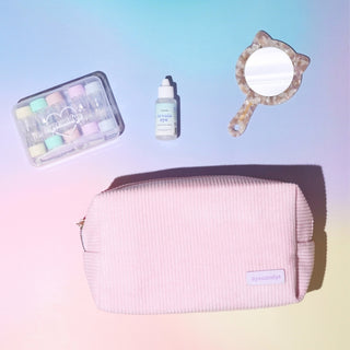 EyeCandys pouch with prescription colored contact lenses case, mirror and eye drops being taken out and put back in for organized storage and easy travel